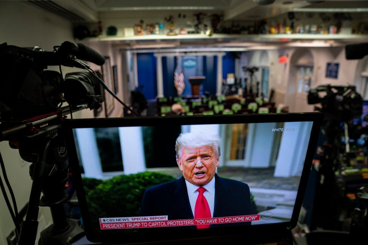 Then-President Donald Trump's recorded message to rioters is seen on a television screen in the White House briefing room as supporters are removed from the Capitol building, on Jan. 6, 2021, in Washington, DC. MUST CREDIT: Washington Post photo by Jabin Botsford