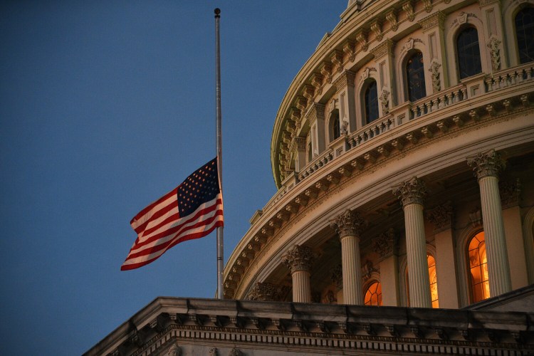 The U.S. flag at half-staff at the Capitol on the first anniversary of the Jan. 6 insurrection.