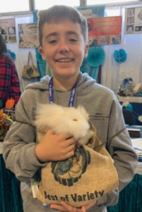 Jack McDevitt of Wells poses with his prize-winning rabbit Hey Jude, that placed first nationwide in the youth division at the 98th Annual American Rabbit Breeders Association Convention in Louisville, Ky., last November. 