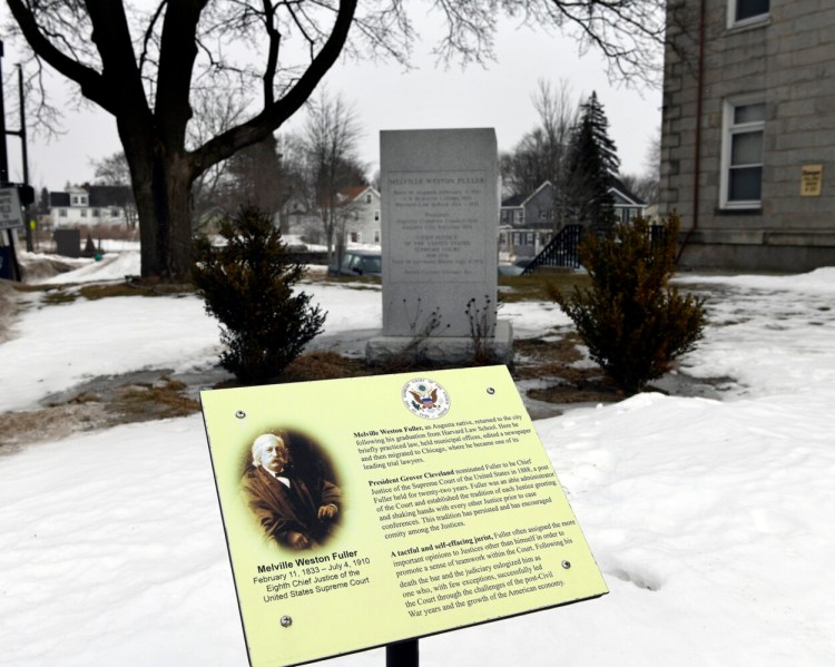 All that remains Monday of the statue of Melville W. Fuller outside the Kennebec County Courthouse in Augusta is its granite base and a plaque with information about Fuller. The bronze impression of the former chief justice of the Supreme Court of the United States was removed Sunday.