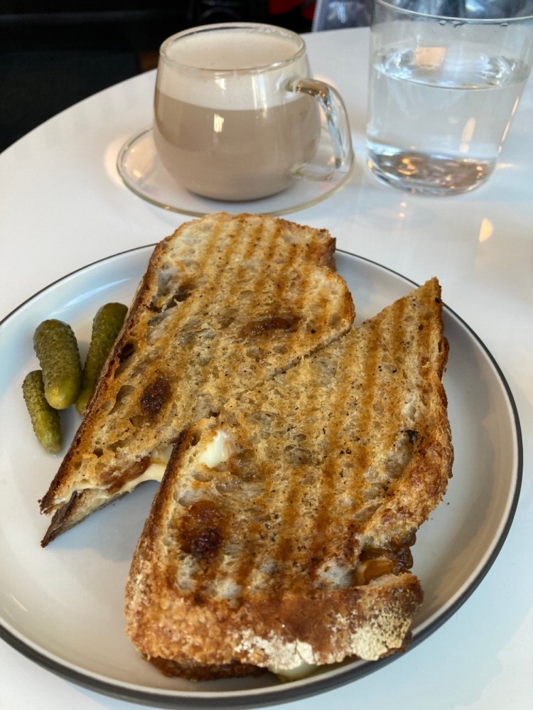 A chai latte and grilled cheese with French onion jam, taleggio cheese and Dijon mustard from Smalls in Portland's West End.