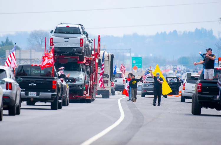 Large numbers of people lined the bridges and roadways in Frederick County as the “People’s Convoy” passed through the county as they made their way from Hagerstown to Washington on Sunday.