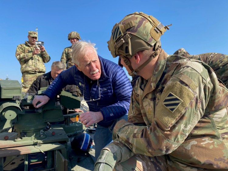 Maine Sen. Angus King speaks with a member of the 82nd Airborne during a visit in Poland on Sunday. King and Sen. Susan Collins visited Germany and Poland to witness how Russia's invasion of Ukraine has impacted the citizens of that country as well as America's allies on NATO's eastern flank.