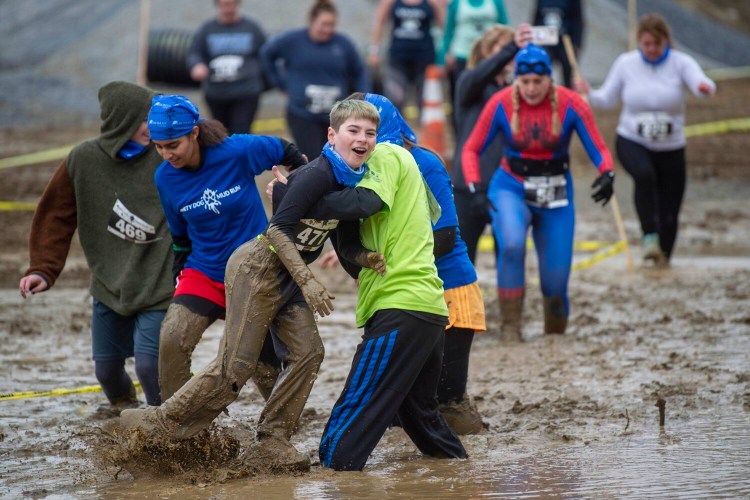 Some good clean fun at the Thomas College Dirty Dog Mud Run in Waterville last year. 