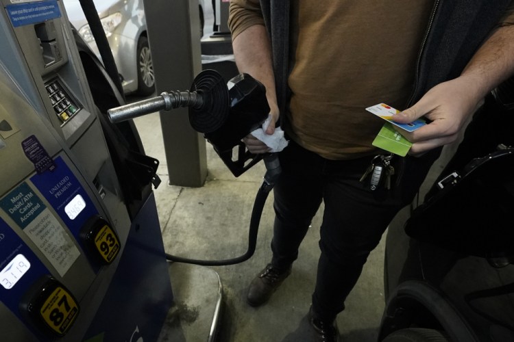 A customer prepares to pump gasoline into his car at a Sam's Club fuel island in Gulfport, Miss., Feb. 19. The U.S. economy shrank last quarter, contracting at a 1.4% annual rate. 
