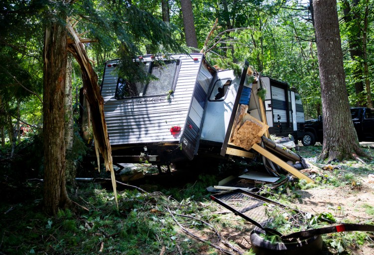 A sudden and severe storm hit Sebago Lake Family Campground on Thursday afternoon, felling trees and causing massive destruction, including damaging this camper. A 9-year-old girl was killed when a tree fell on a car. 