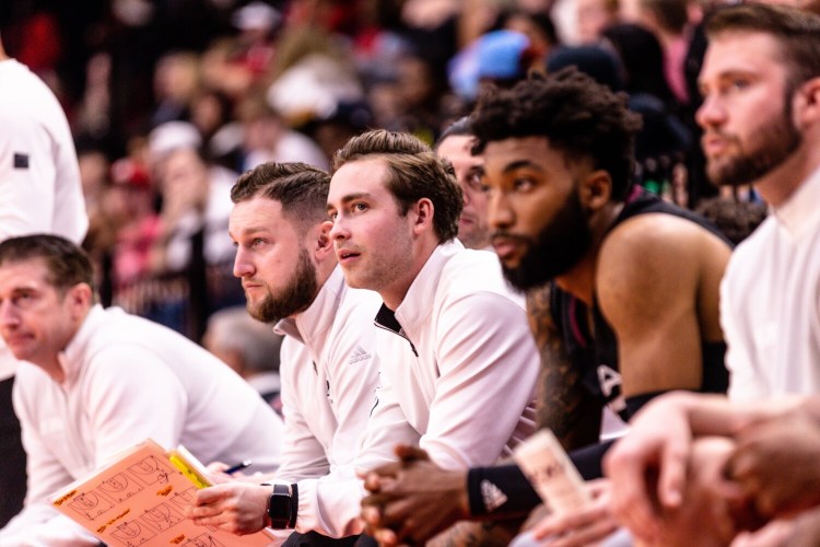 Lawrence High School graduate Mason Cooper, second from right, was recently promoted to Director of Basketball Operations at Eastern Kentucky University. Cooper is in this third season serving on head coach A.W. Hamilton's staff.