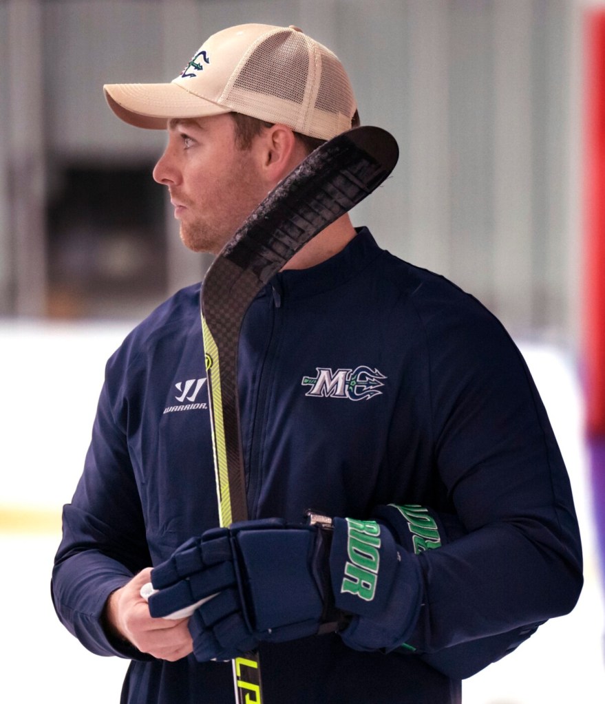 PORTLAND, ME Ð OCTOBER 11: Terrence Wallin, the new head coach of the Maine Mariners, listens to a player during a break in the teamÕs first practice of the season at Troubh Ice Arena in Portland on Tuesday, October 11, 2022. (Staff photo by Gregory Rec/Staff Photographer)
