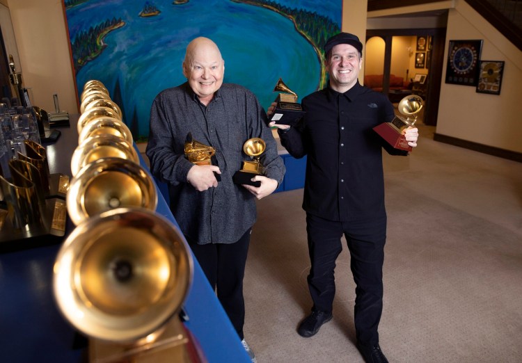 Bob Ludwig, left, and Adam Ayan of Gateway Mastering in Portland pose with their Grammys in January. Ludwig is retiring this year after more than 50 years. 