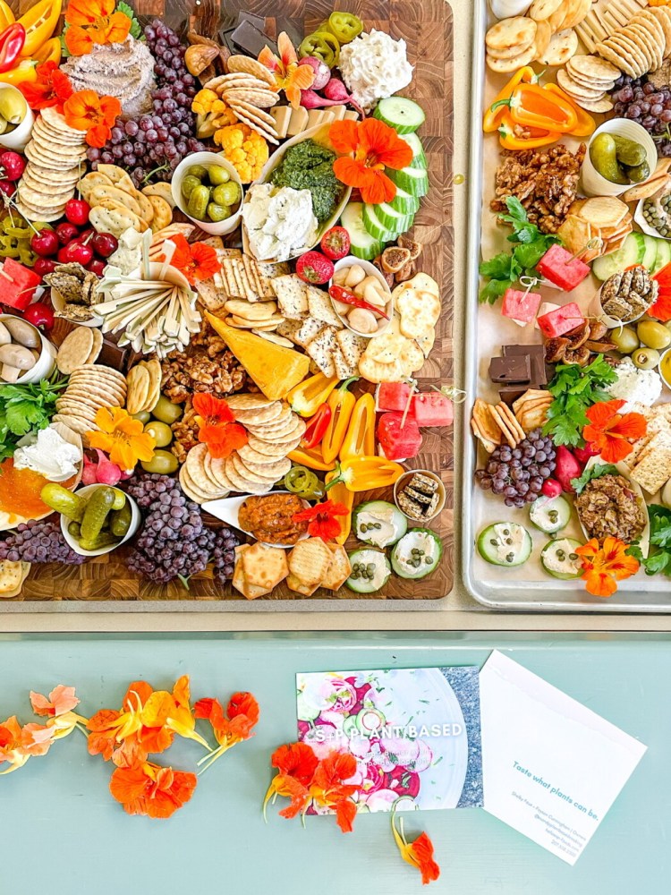 An attractive vegan charcuterie board, like these ones crafted by S+P Social of Newcastle, is colorful, filled with fruits and veggies, and features a variety of bite-sized morsels.
