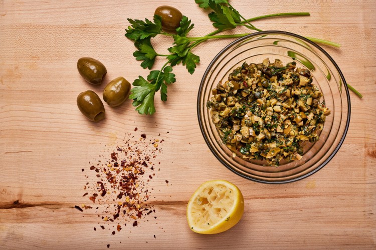 The salsa includes green olives, capers, olive oil, dill, parsley, lemon and crushed red pepper flakes. 