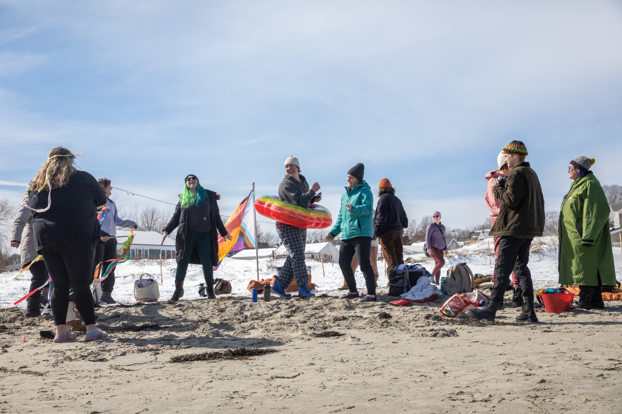 Hundreds descend on Willard Beach for a chilly dip in Casco Bay to