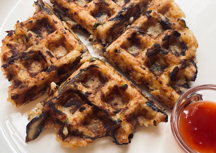 A Walking Fried Rice Waffle with ginger, garlic, miso and more. Dip in hot sauce, if you like.  