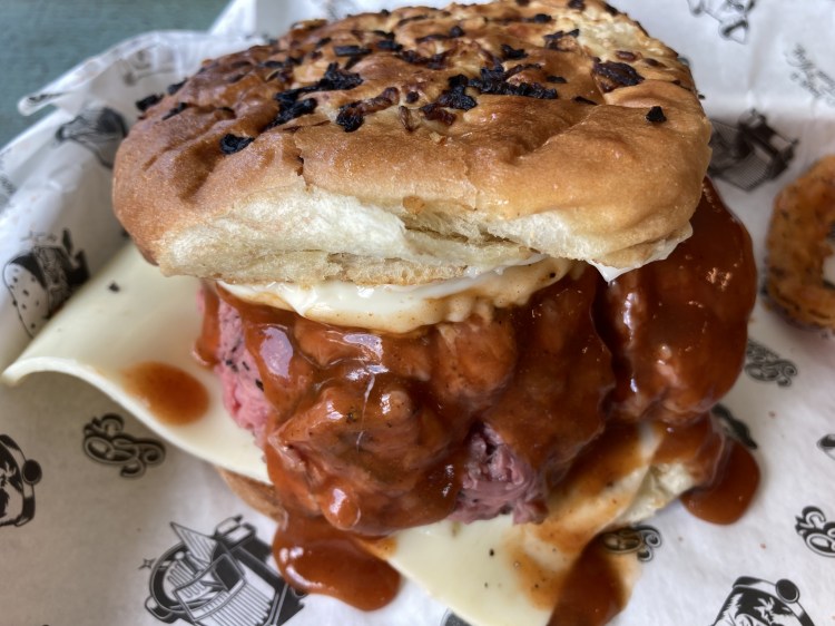The Super Beef at George + Leon's, with beef, BBQ sauce, white American cheese and mayo on an onion roll. 