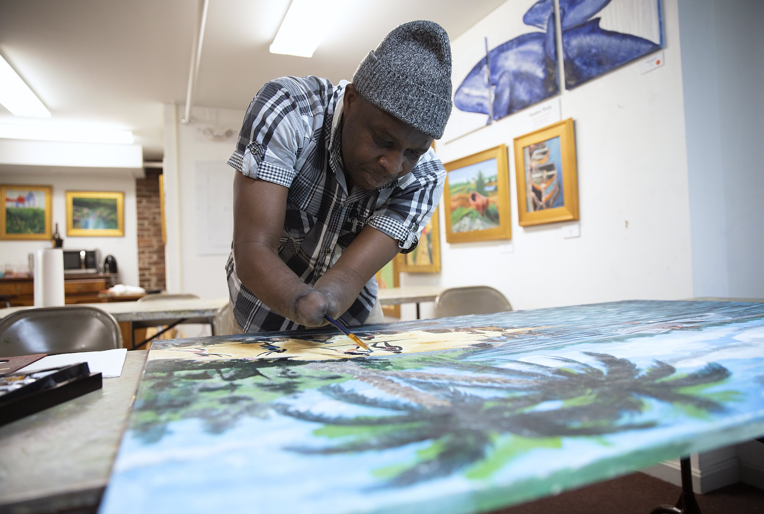 For Rwandan artist who lost his hands in an attack painting leads