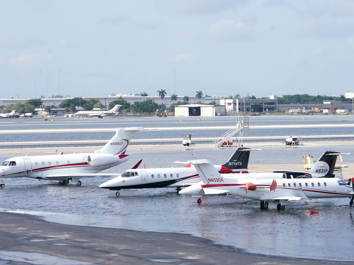 Small planes are parked at Fort Lauderdale- Hollywood International Airport, after the airport was force to shut down due to flooding, Thursday, April 13, 2023, in Fort Lauderdale, Fla. It's been a rainfall tale of two states in Florida this year, where the southeast coast has been inundated by sometimes-record rainfall and much of the Gulf coast is dry as a bone.