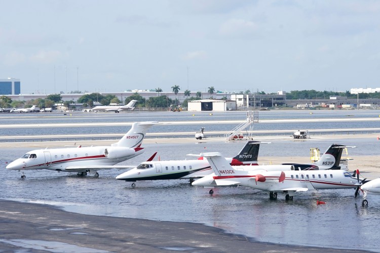 Small planes are parked at Fort Lauderdale- Hollywood International Airport, after the airport was force to shut down due to flooding, Thursday, April 13, 2023, in Fort Lauderdale, Fla. It's been a rainfall tale of two states in Florida this year, where the southeast coast has been inundated by sometimes-record rainfall and much of the Gulf coast is dry as a bone.