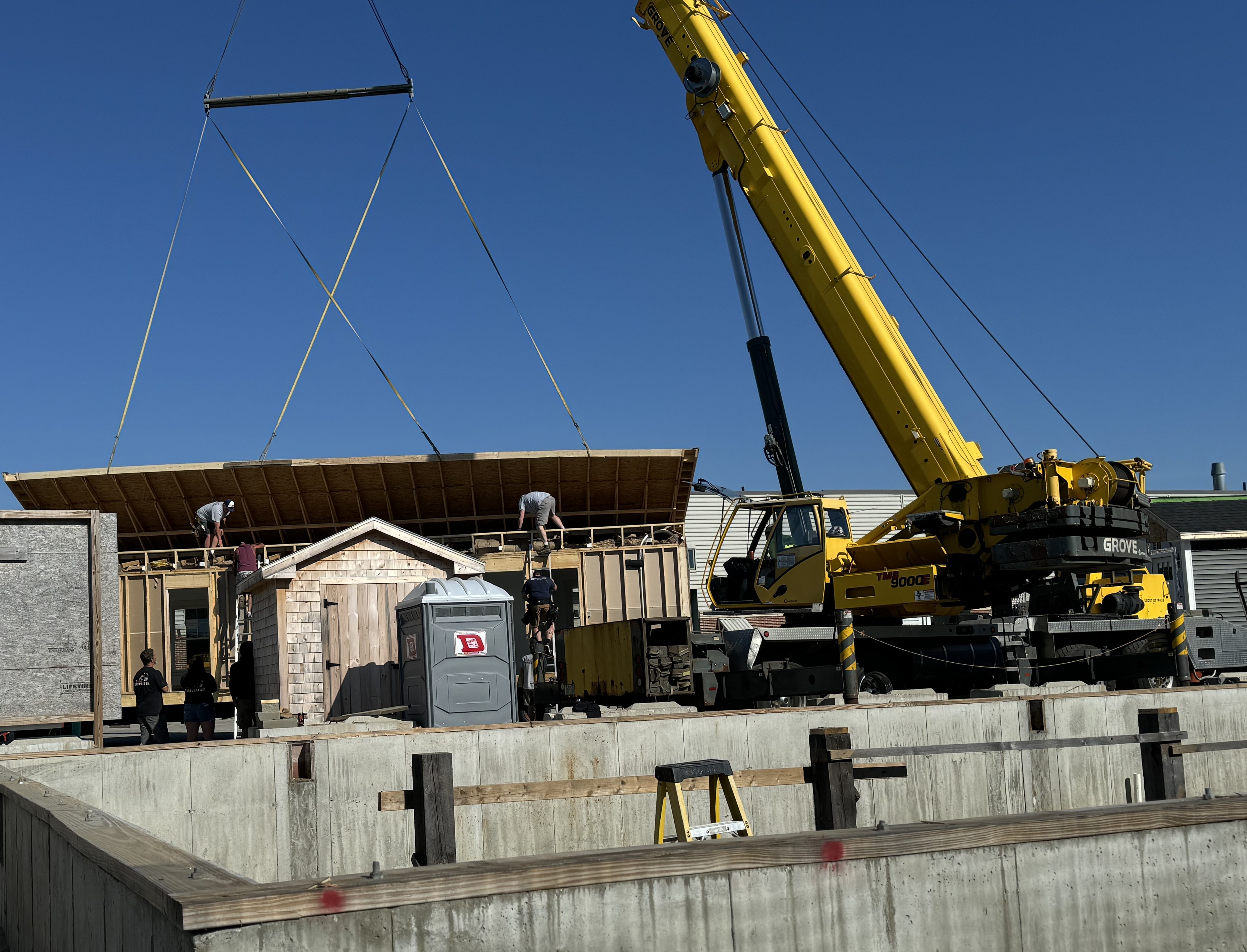 Oxford Hills Tech School sends student-built spec house to new home