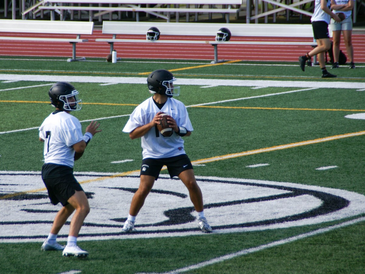Senior Robbie Long, left, and sophomore Michael Wolfendale compete for the starting quarterback position on Thursday, Aug. 22, 2024.