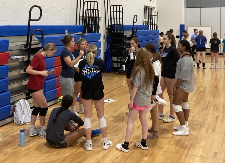 Head coach Janey Martin speaks with the varsity volleyball team after a practice at Mt. Ararat High School on Wednesday, Aug. 28, 2024.