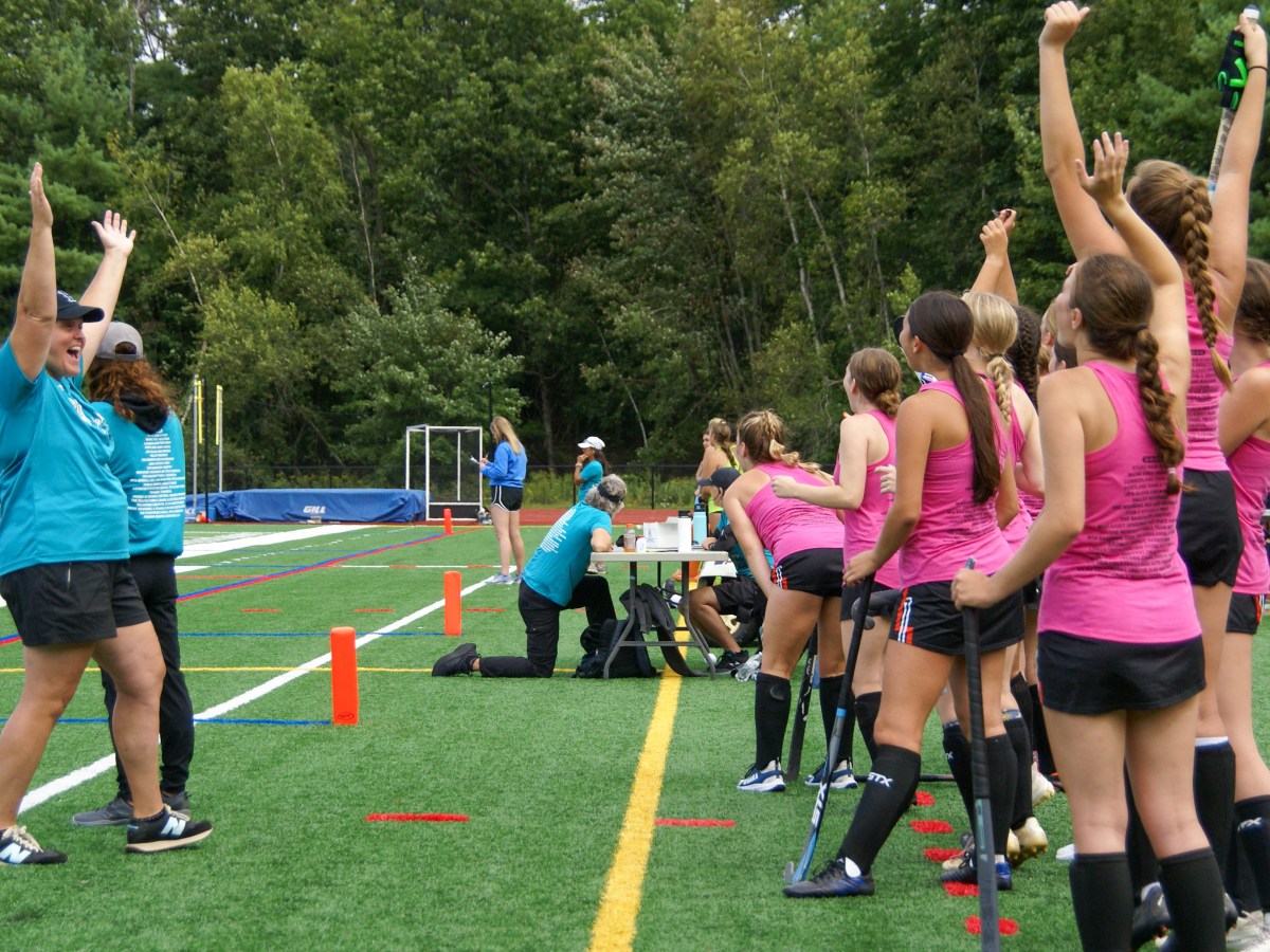 Brunswick head coach Carrie Sullivan turns to her team to celebrate a goal during the 2024 Drive Out Cancer Field Hockey tournament.